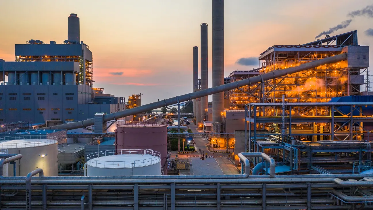 Industrial power plant at dusk — GHG and carbon emissions accounting